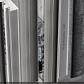 Neatly Stacked White And Gray Books On Gray Background Surface