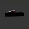 Sliced Purple Onion On Wooden Cutting Board With Black Handle Knife