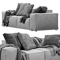 Stylish Two Seater Sofa With Decorative Pillows And Cozy Blanket In Modern Living Room Interior