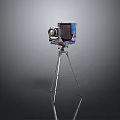 Vintage Electronic Camera With Blue Decorated Body On Metal Tripod Stand