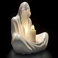 White Ceramic Hooded Figure Sculpture With Seated Pose And Lit Candle