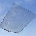 Transparent Square Mesh Sheet With Wavy Edges Against Blue Sky Background 3d model