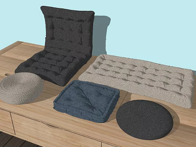 Soft Seat Cushions In Different Colors And Shapes On Wooden Table 3d model