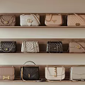 Stylish Leather Handbags Displayed on Wooden Shelves with Various Colors and Designs