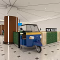 Tuk Tuk Cafe Interior With Blue Tuk Tuk Vehicle Green Plant Wall And Wooden Counter