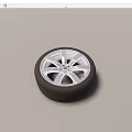 Car Tire With Silver Alloy Rim And Stylish Tread Pattern Design