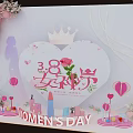 Women's Day Decorative Setup With Heart Shaped Crown Rose Cosmetic Models And Pink Balloons