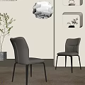 Two Modern Light Gray Dining Chairs With Black Legs In Minimalist Room With Pendant Light