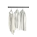 Three White Clothes Hanging On Metal Hanger For Stylish Wardrobe