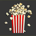 Crispy Popcorn Overflowing from Red and White Striped Box with Scattered Bits