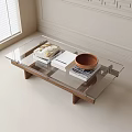 Modern Glass Top Coffee Table With Wooden Legs Books And Wooden Bowl