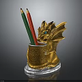 Golden Dragon Shaped Pencil Holder With Red Green Yellow Pencils And White Patterned Base