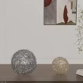 Decorative Ornament Set with Silver Golden Spherical Woven Decor on Wooden Floor and Open Book
