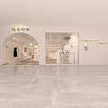 Modern Clothing Store Interior With Green Sofa Display Area And Decorative Plants