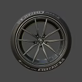 Car Tire With Modern Alloy Wheel Rim Black Spoke Design And Branded Sidewall
