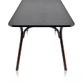 Dark Wood Dining Table With Curved Legs And Smooth Surface Modern Design Style