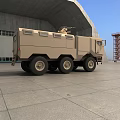 Rugged 6x6 Armored Military Vehicle With Roof Mounted Equipment On Concrete Ground