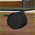 Black Furniture Wheel With Brake On Wooden Floor Surface