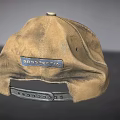 Vintage Brown Cotton Hat with Circular Badge and Yellow Leaf Patch
