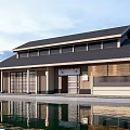 Traditional Japanese Guesthouse Building With Black Roof Wooden Sliding Doors And Pond Reflection