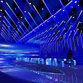 Modern Fashion Runway Stage With Blue Illuminated Geometric Lines And Futuristic Lighting Design