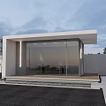 Modern Minimalist Building With Glass Facade White Walls Small Trees Black Paved Ground Exterior Design