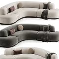 Modern Curved Sectional Sofa With Beige Dark Gray Tones Decorative Pillows And Knit Blankets