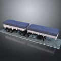 Two Flatbed Trailers With Blue Tarpaulin Covers On Gray Platform