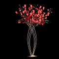 Red Floral Arrangement in Metal Spiral Vase with Black Background