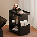 Modern Black Side Table With Flowers Coffee Cup Wine Bottle Radio And Books On Wheels