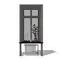 Casement Window with Gray Frame and Table Below Featuring Plant Candles Vase and Radiator