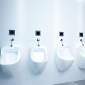 Clean Modern Bathroom Interior With Four Wall Mounted White Urinals And Green Plant