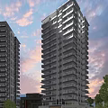 Modern High Rise Residential Buildings With Balconies Under Warm Sunset Sky
