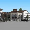 Mediterranean Style Commercial Street With Arched Windows Red Rooftops And Green Trees