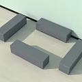 Gray Rectangular Stools Placed Against the Wall on Light Colored Floor 3d model