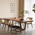 Modern Wooden Dining Table And Chairs Set With Indoor Potted Plant And Wall Art