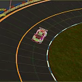 Green Racing Car Driving On Curved Race Track With Red Blue Barriers And Green Grass