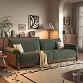 Green Velvet Sofa And Coffee Table Set With Wooden Legs Striped Pillows And Knit Blanket