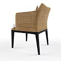 Stylish Wicker Armchair With Black Legs White Cushion And Red Patterned Pillow