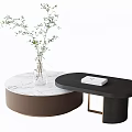 Round Black Coffee Tables With Marble Top Brown Base Glass Vase Green Plant And Book