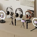 Wooden Desk Setup With Ring Lights Headphones And Phone Tripods
