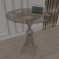 Round Side Table In Modern Interior With Transparent Patterned Top And Metal Wireframe Base