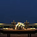 Dining Table Set Featuring Candle Holders Floral Arrangement Tableware in Outdoor Night with Railing Lighting