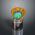 Green Ice Cream Ball With Colorful Sprinkles In Yellow Wrapper And Metal Container