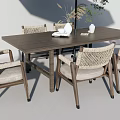 Outdoor Table and Chair Set with Rattan Chairs Wooden Table Large Umbrella and Green Plants