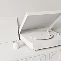 Modern Turntable Audio System With Red Vinyl Record On Wooden Base And Candles