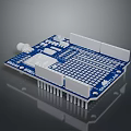 Blue Computer Circuit Board With White Components And Grid Pattern Pins 3d model