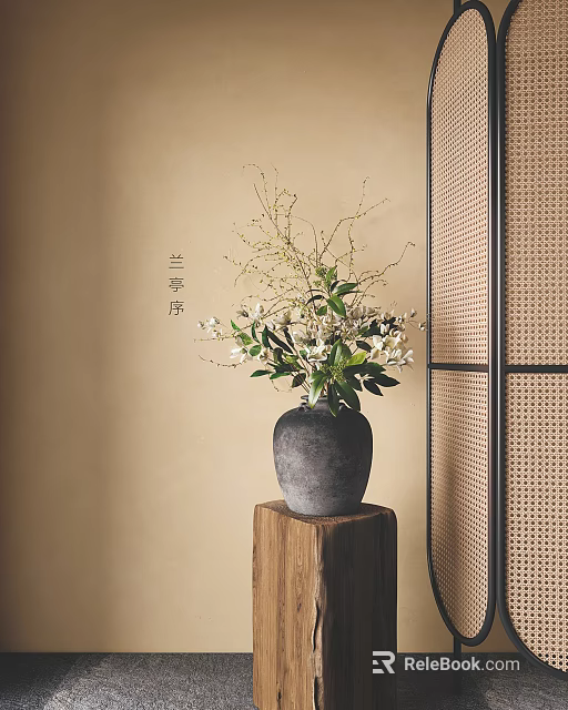 Gray Ceramic Vase With White Flowers And Green Leaves On Wooden Stand Against Beige Wall 3d model 