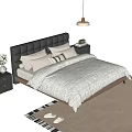 Double Bed with Black Leather Tufted Headboard White Striped Quilt Wooden Nightstands and Lamp