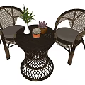 Wicker Furniture Set With Two Chairs Round Table And Potted Plants